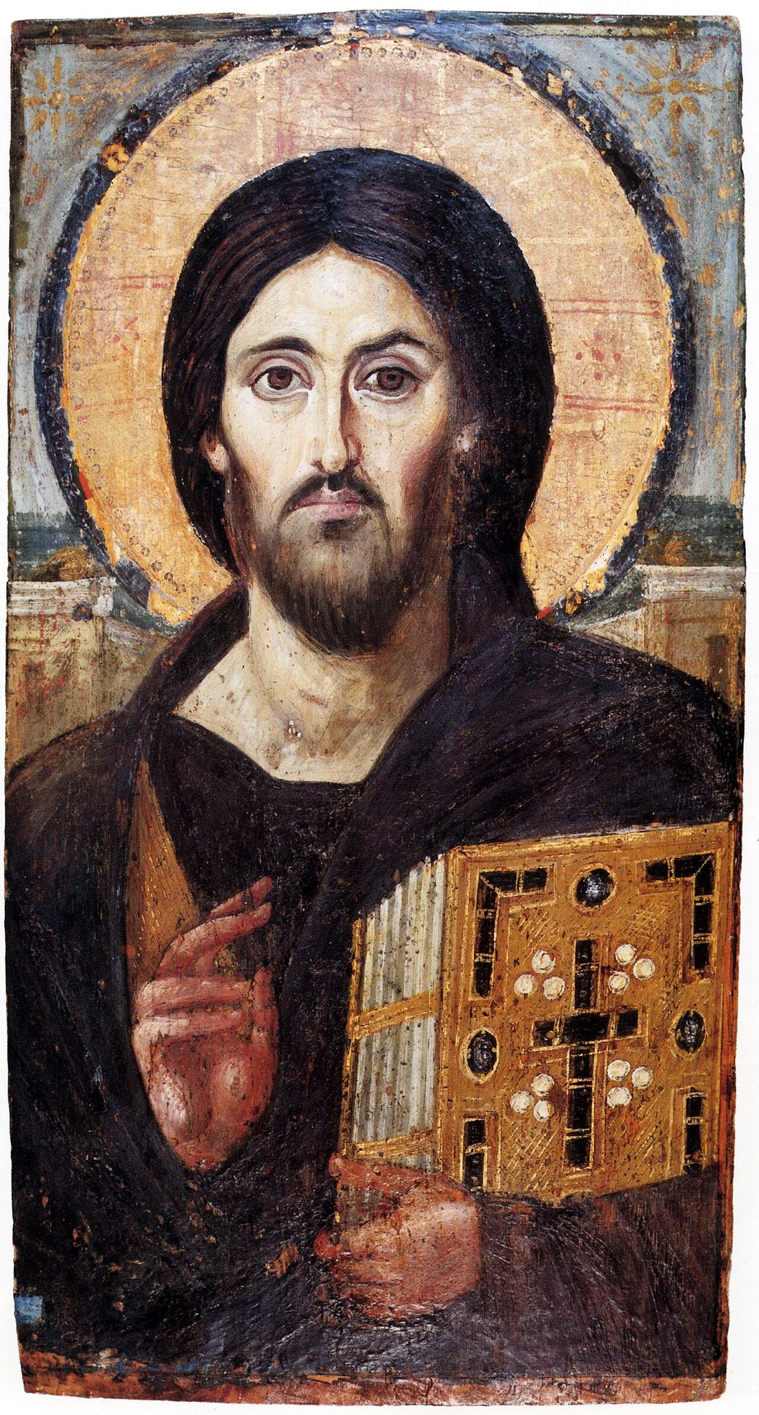 Sixth-century encaustic icon of Christ, holding a jewelled gospel book in his left hand and raising his right in blessing; the two halves of his face are noticeably unlike each other.