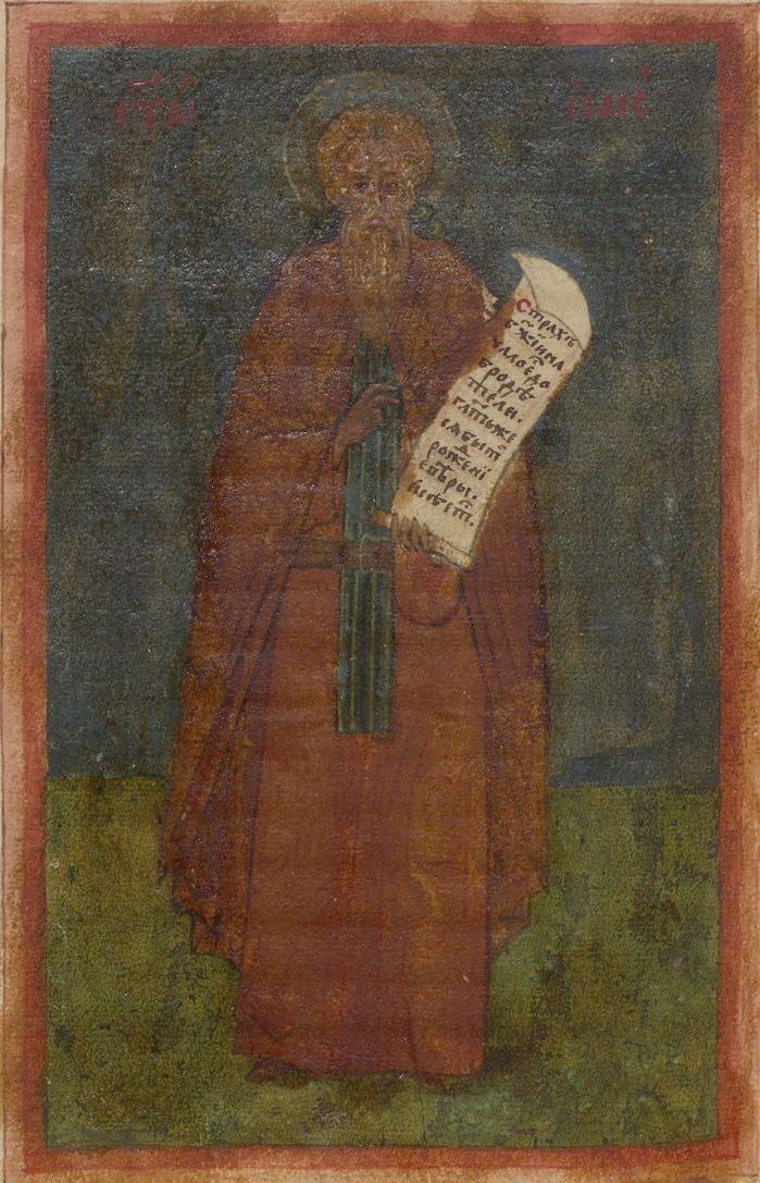 Slavonic manuscript miniature of Isaac the Syrian standing in a russet monastic habit against a dark blue-grey ground, holding an unrolled scroll inscribed in Church Slavonic.