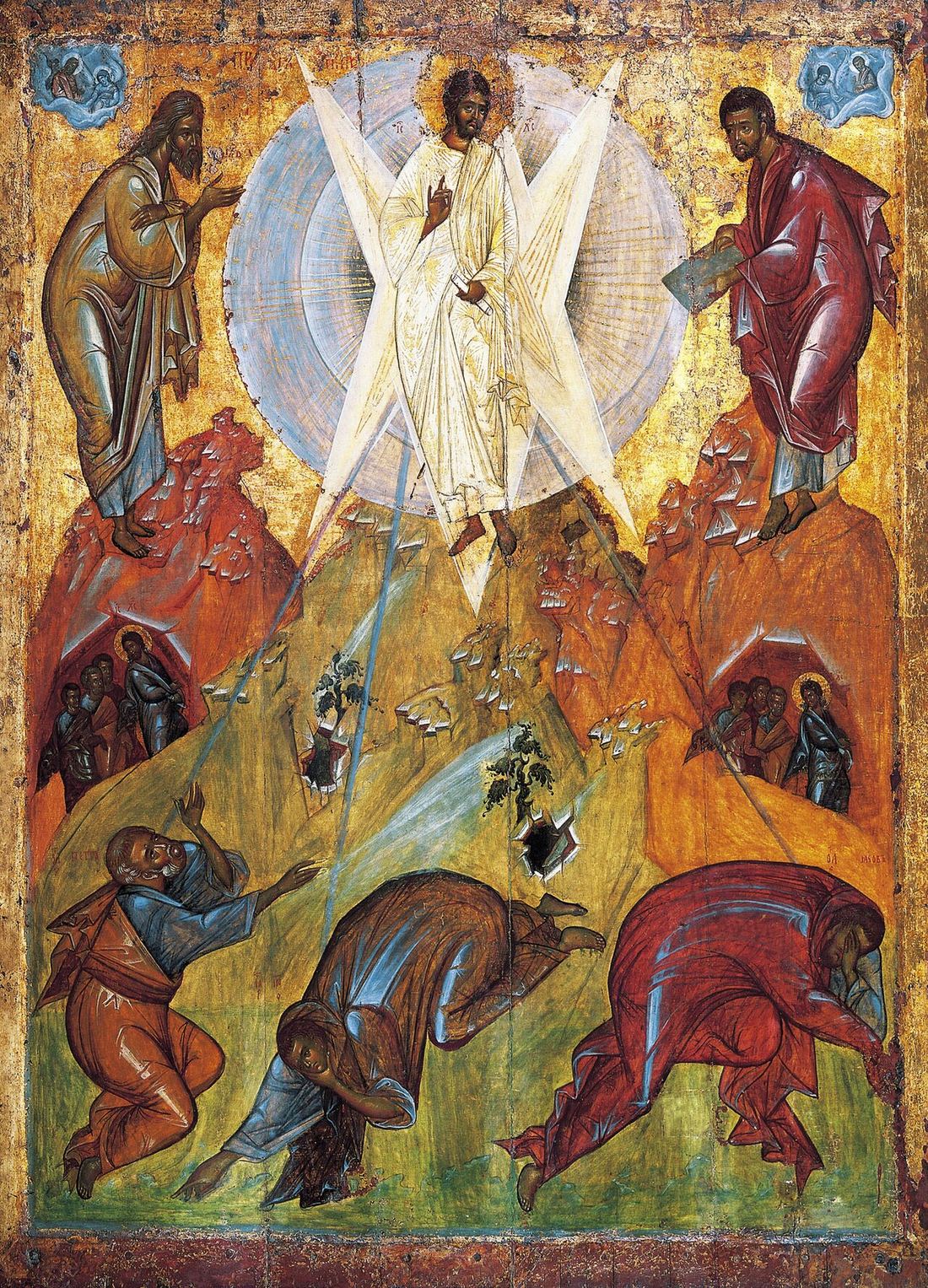 Icon of the Transfiguration: Christ in white on a peak between Moses and Elijah, standing in a pale silvery-blue circular mandorla of concentric rings, from which a white six-pointed star of rays breaks outward and down to three disciples sprawling on the rocks below.